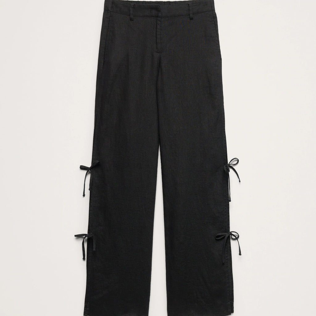 Black wide-leg cropped pants with side tie-front details, shown flat against a light gray background.