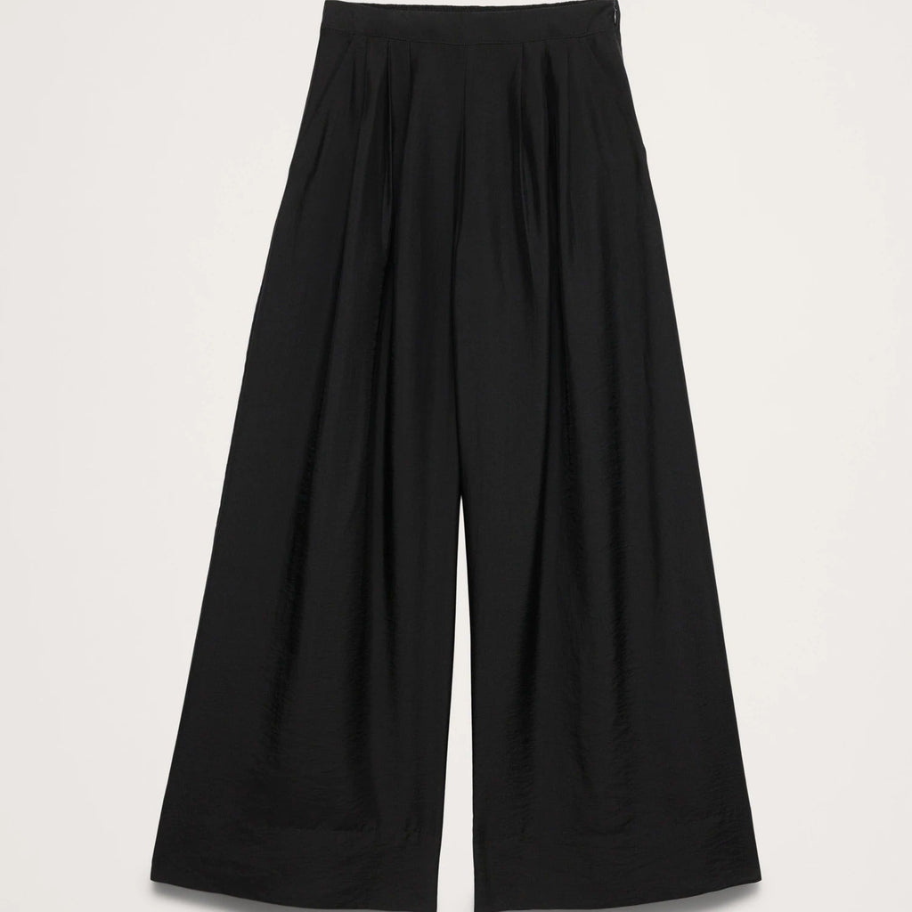 Black wide-leg pants on a light gray background