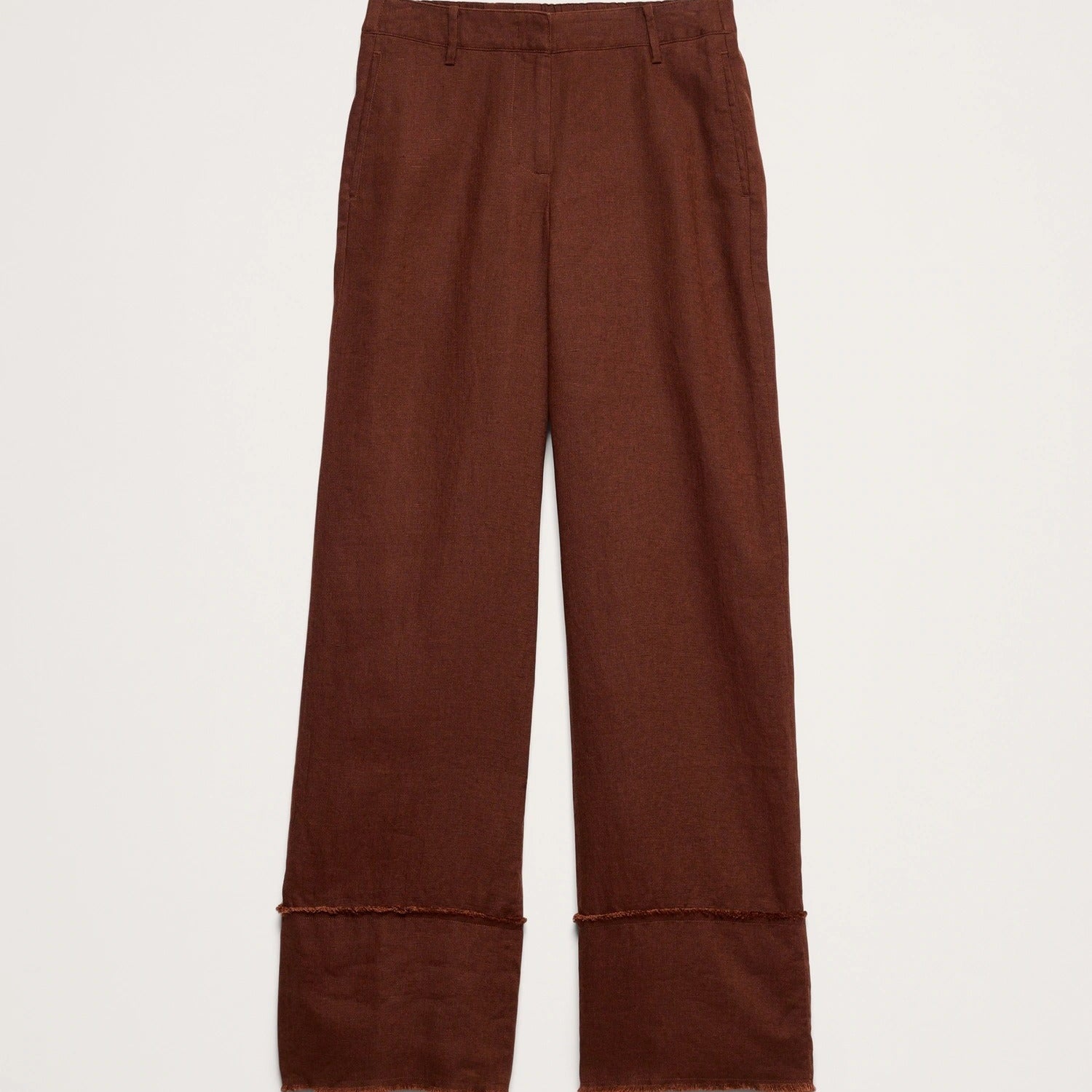 A pair of wide-leg brown trousers with rolled cuffs, shown flat against a light off-white background.