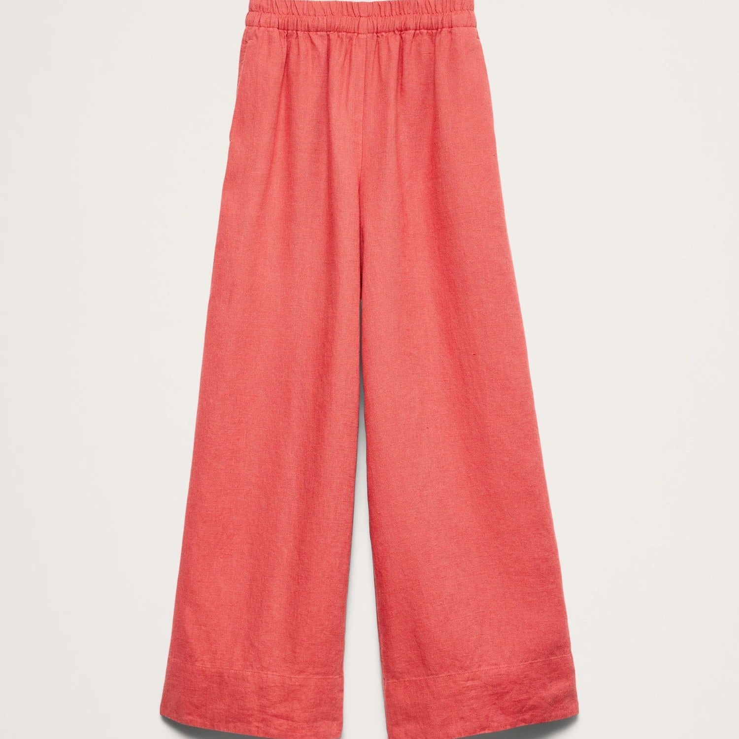 Coral colored wide leg trousers with an elasticated waist