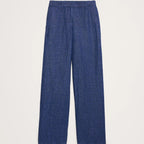 A pair of blue wide-leg trousers with a textured, slightly heathered fabric, shown flat against a light off-white background.