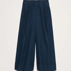 Navy blue wide-leg pants on a light gray background