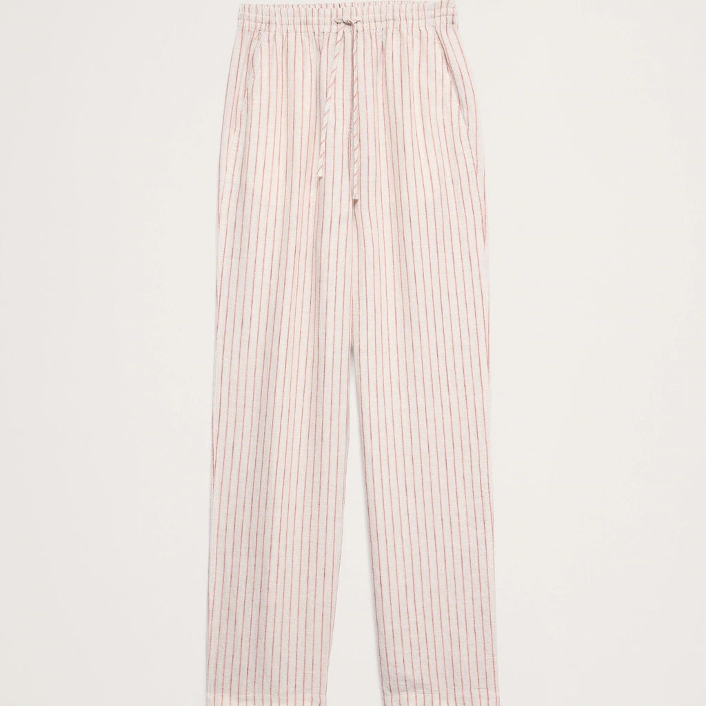 Light pink and white vertically striped cropped pants with an elastic waistband and drawstring, shown flat on a light gray background.
