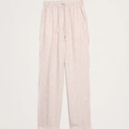 Light pink and white vertically striped cropped pants with an elastic waistband and drawstring, shown flat on a light gray background.